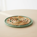 Silicone lick mat for dogs with peanut butter spread on textured surface